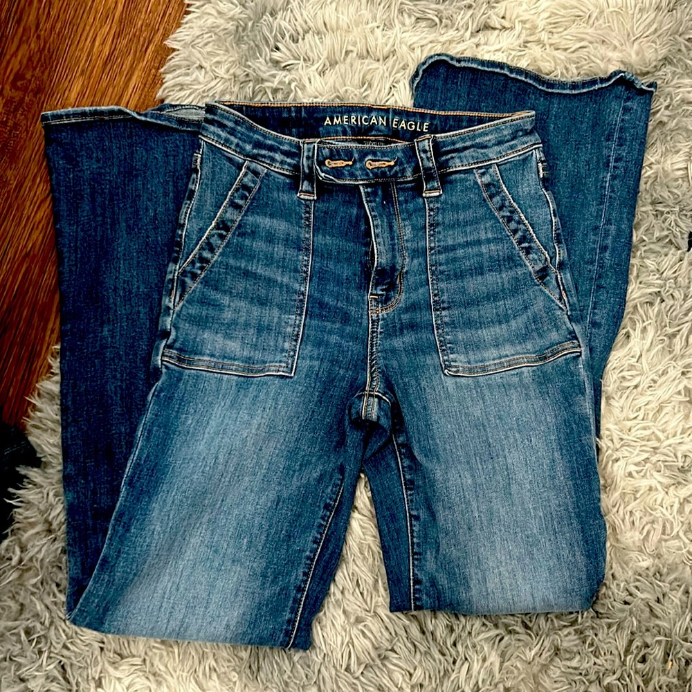 American Eagle bootcut Jean with high rise and cargo pocket at front. Size 4